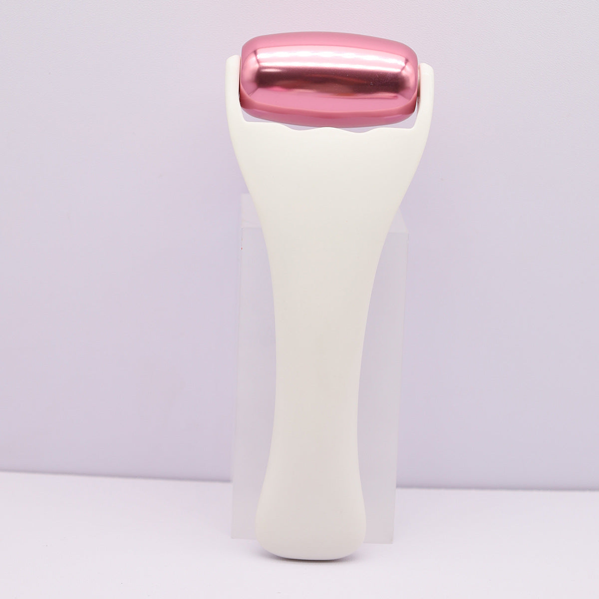 Rouleau de massage en m�tal dor� rose pour le visage et le corps, th�rapie par le froid