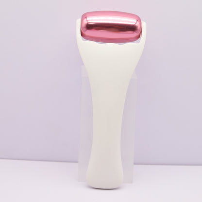 Rouleau de massage en m�tal dor� rose pour le visage et le corps, th�rapie par le froid
