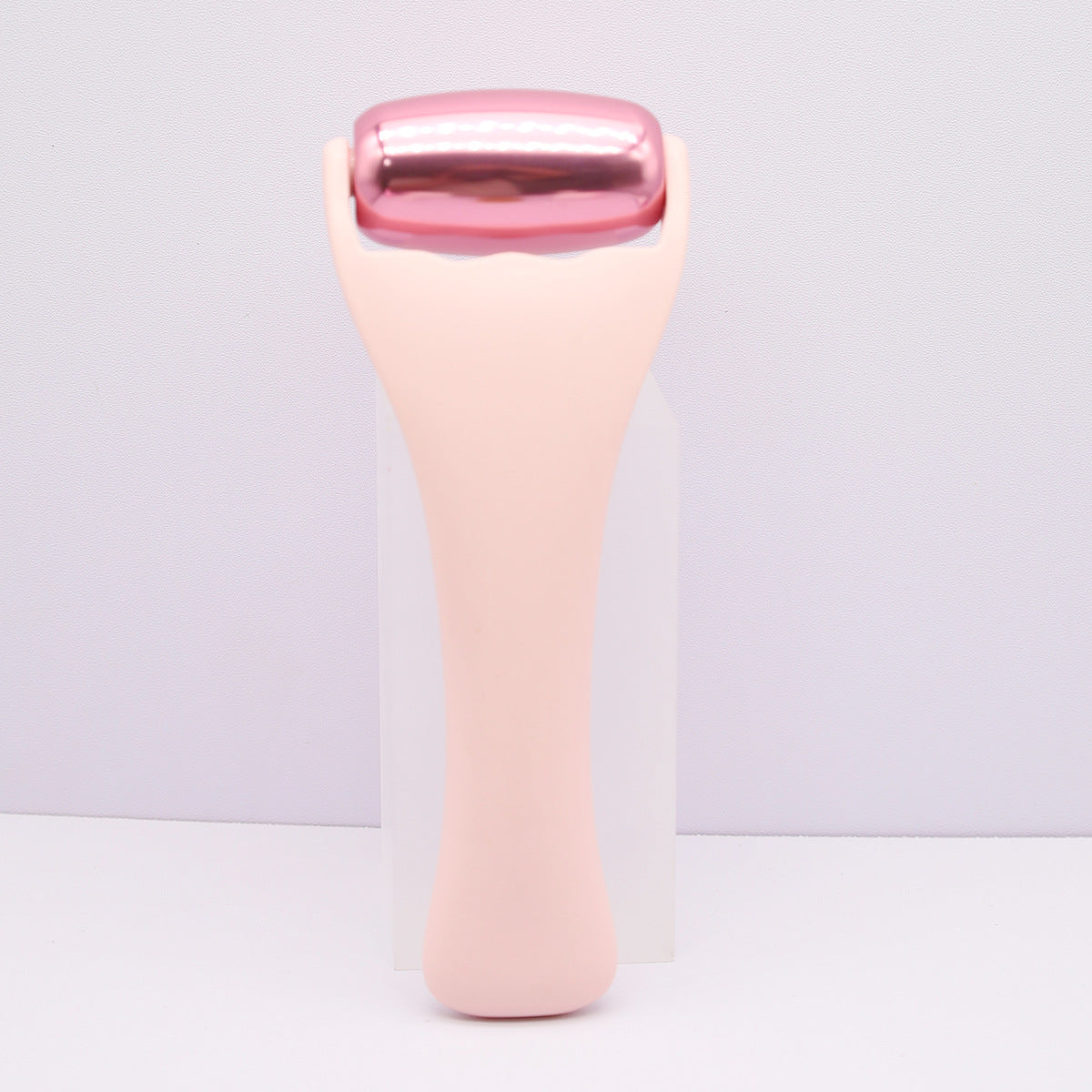 Rouleau de massage en m�tal dor� rose pour le visage et le corps, th�rapie par le froid